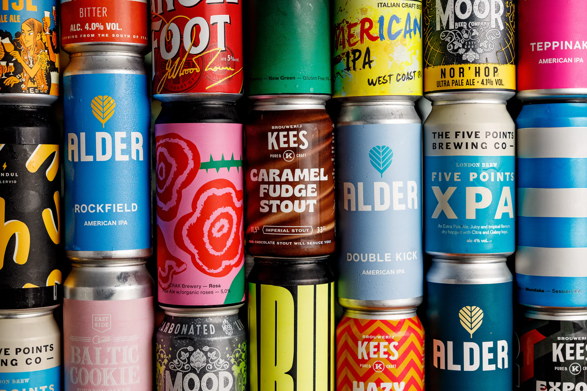 Wall of colourful craft beer cans from various breweries