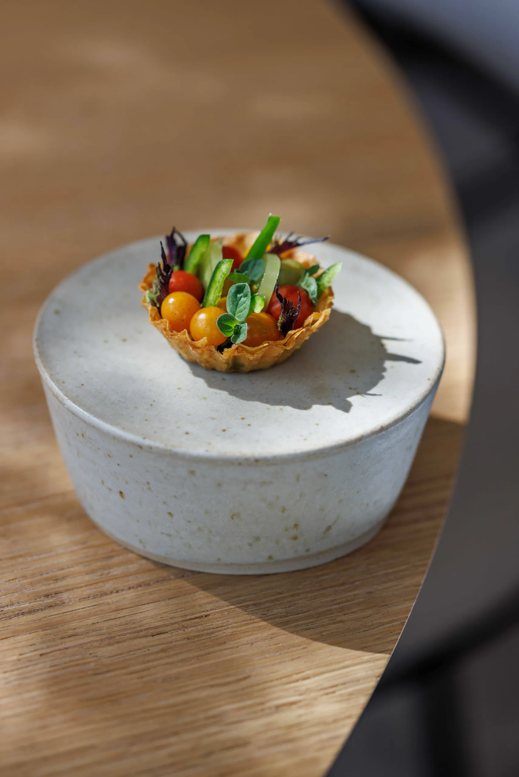Vegetable tartlet presented on an inverted bowl - Orma, Rome, Italy