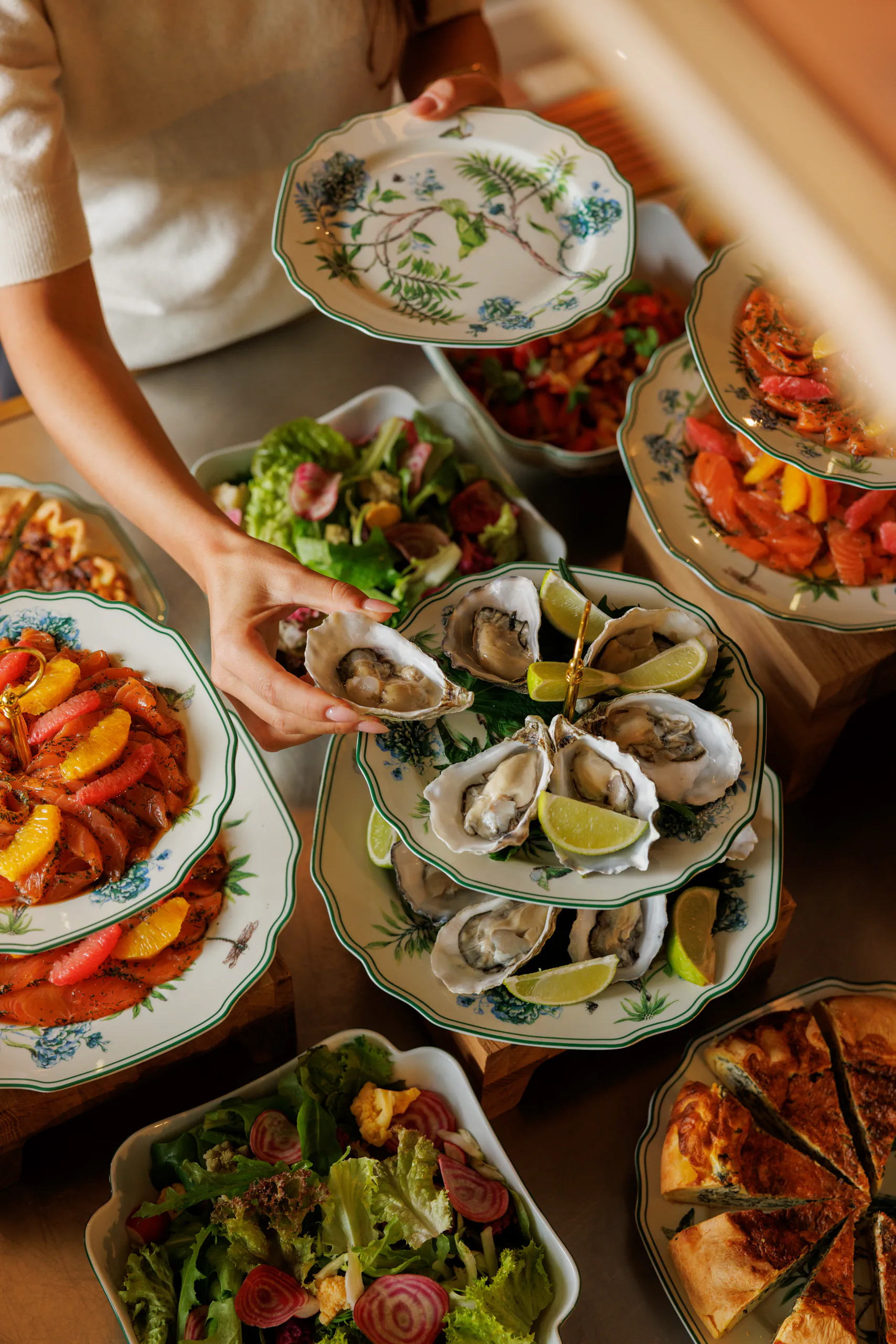 Brunch spread of oysters, seafood and salads being served - Collegio alla Querce, Florence, Italy
