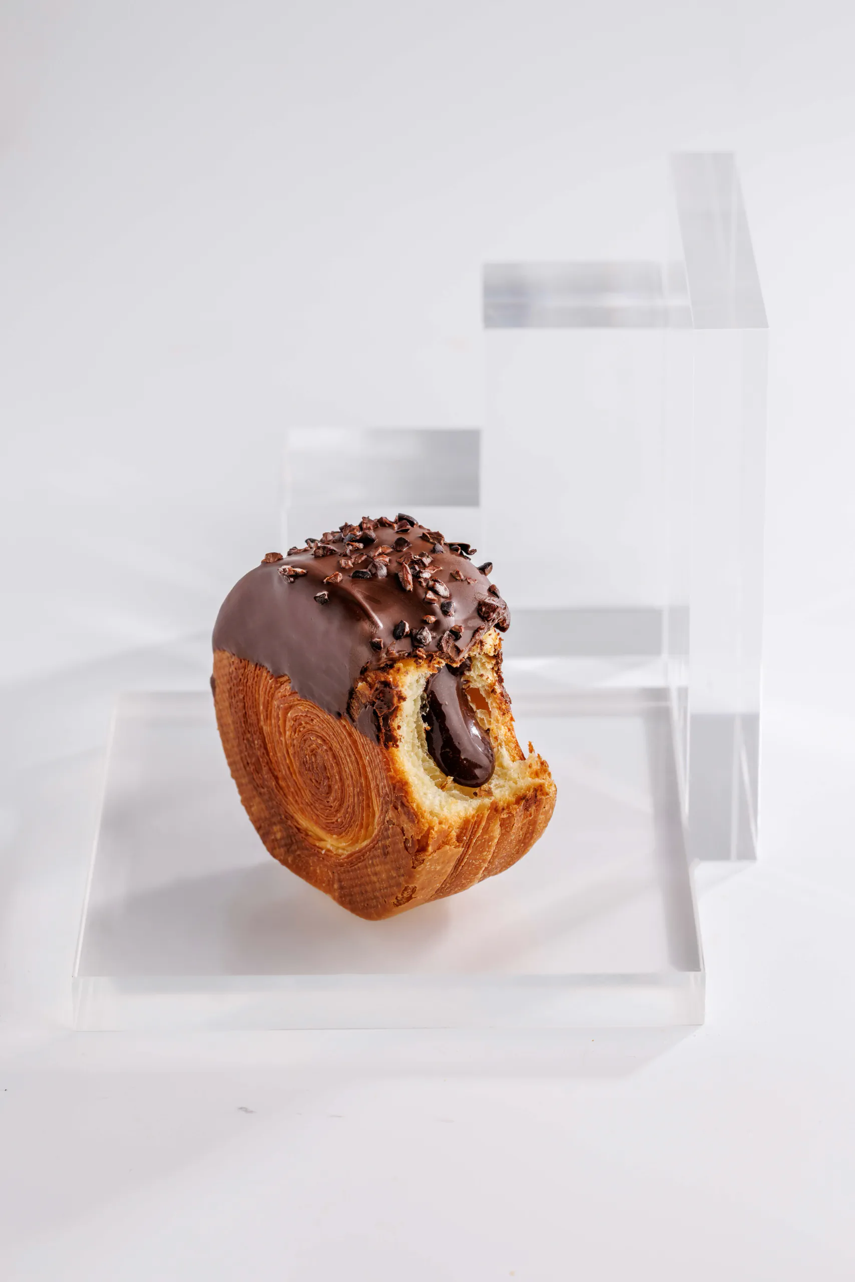 Chocolate-glazed New York roll pastry on acrylic risers - Walter Musco, Rome, Italy